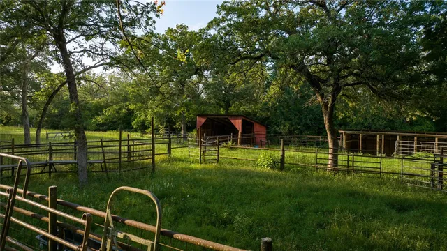 a view of a wooden deck and a yard