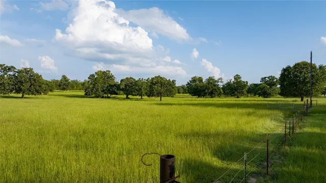 a view of a lake with houses in the back