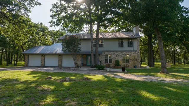 a house view with swimming pool in front of it