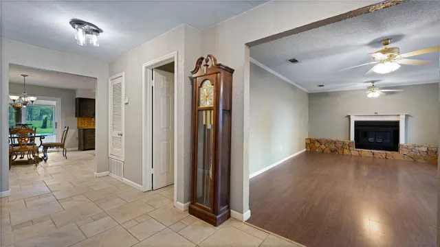 a view of a livingroom with furniture and a ceiling fan