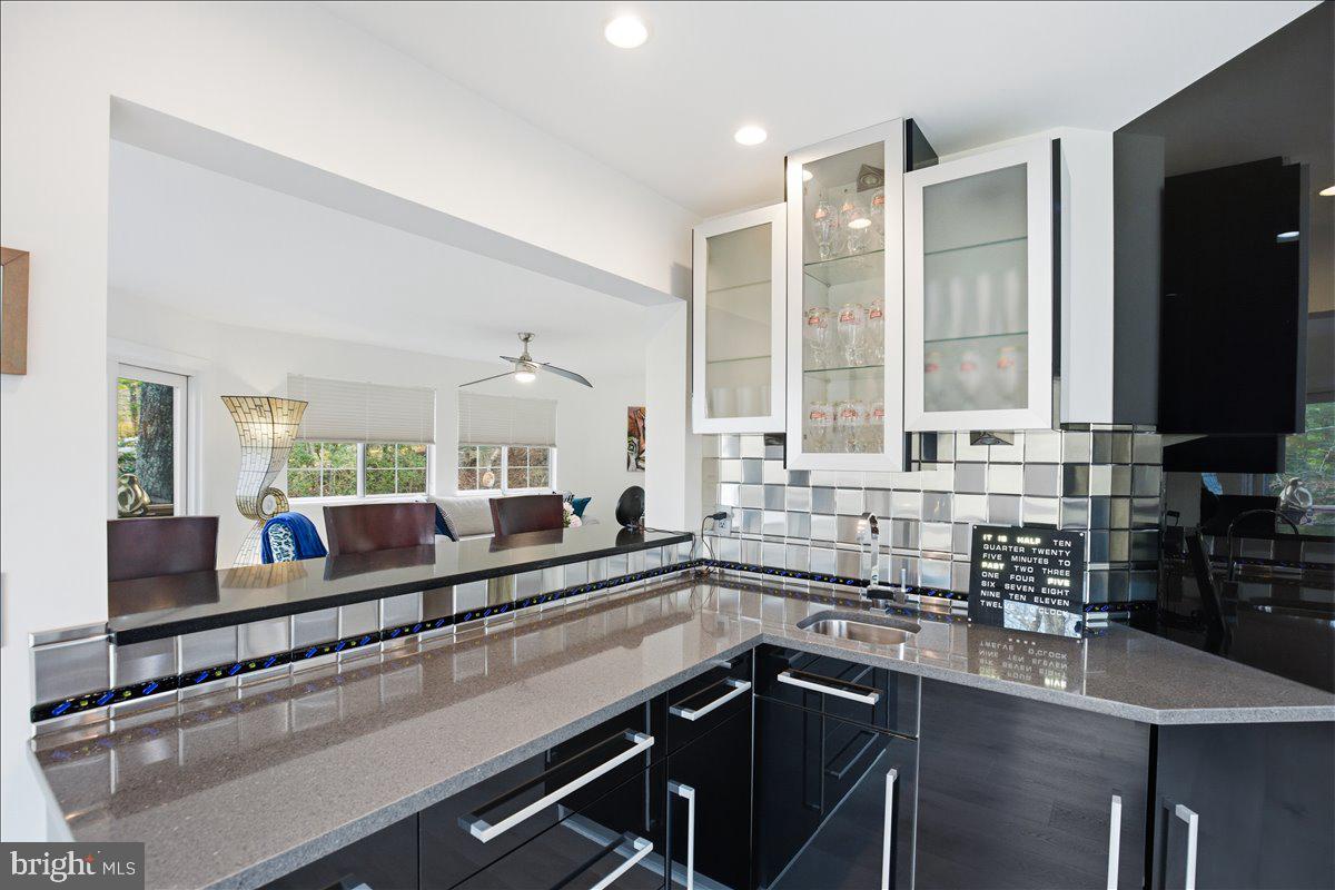 1142 Ranger Ridge Road Lusby, MD 20657 - Photo 20 of 53 a kitchen with a sink and a large window