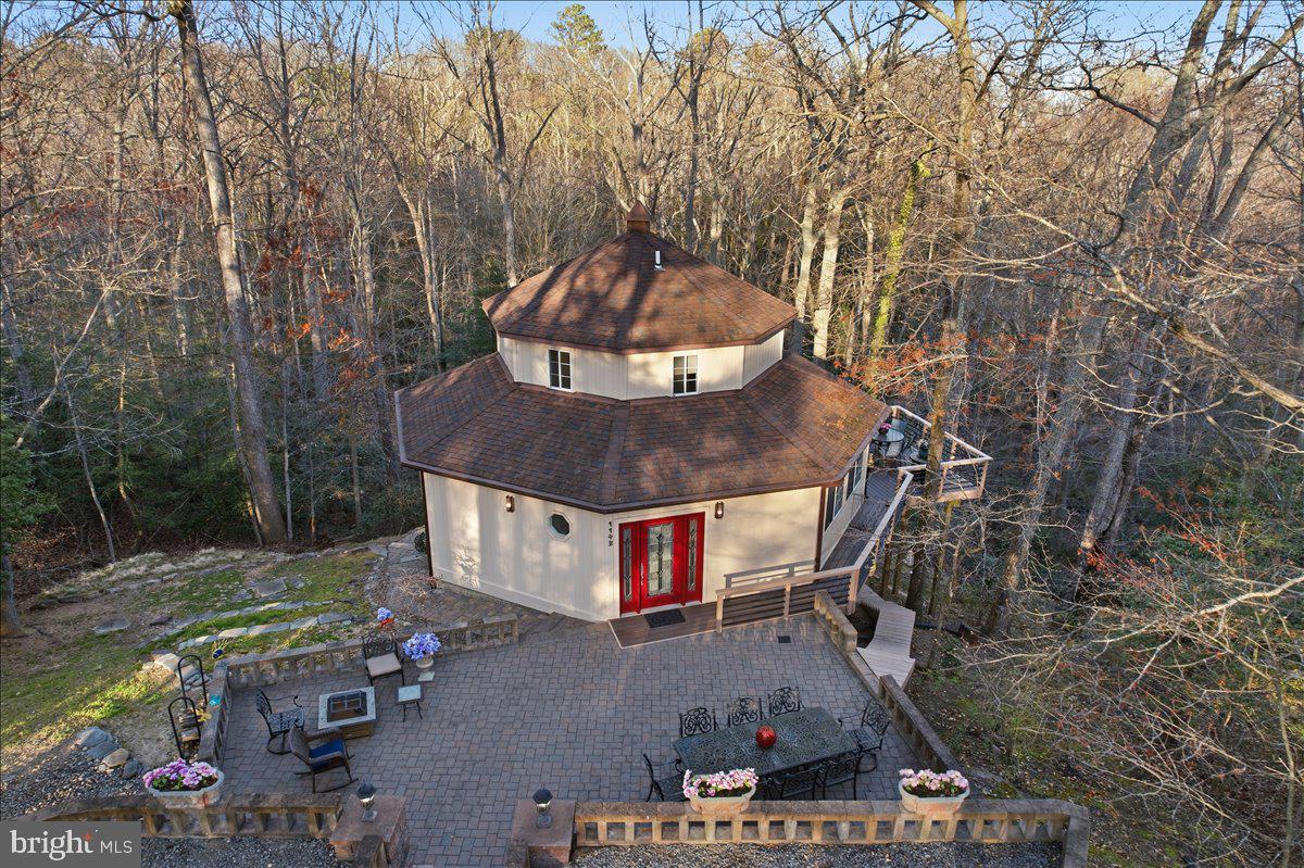 1142 Ranger Ridge Road Lusby, MD 20657 - Photo 2 of 53 a view of a chairs and table in the backyard