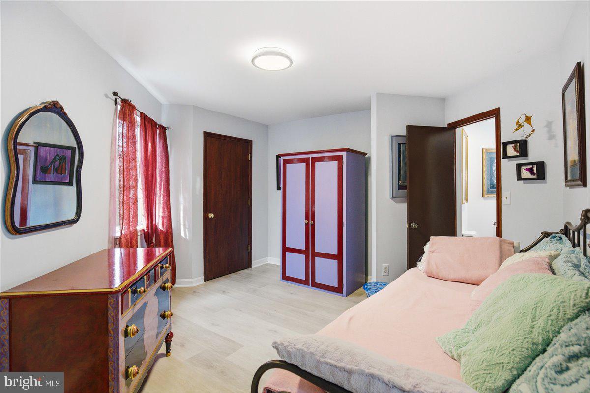 1142 Ranger Ridge Road Lusby, MD 20657 - Photo 21 of 53 a bedroom with a bed and a mirror