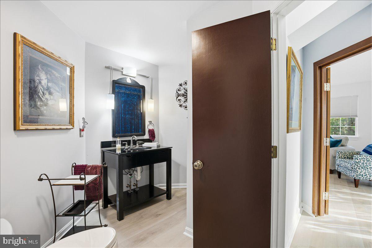 1142 Ranger Ridge Road Lusby, MD 20657 - Photo 22 of 53 a view of a hallway with workspace and a window