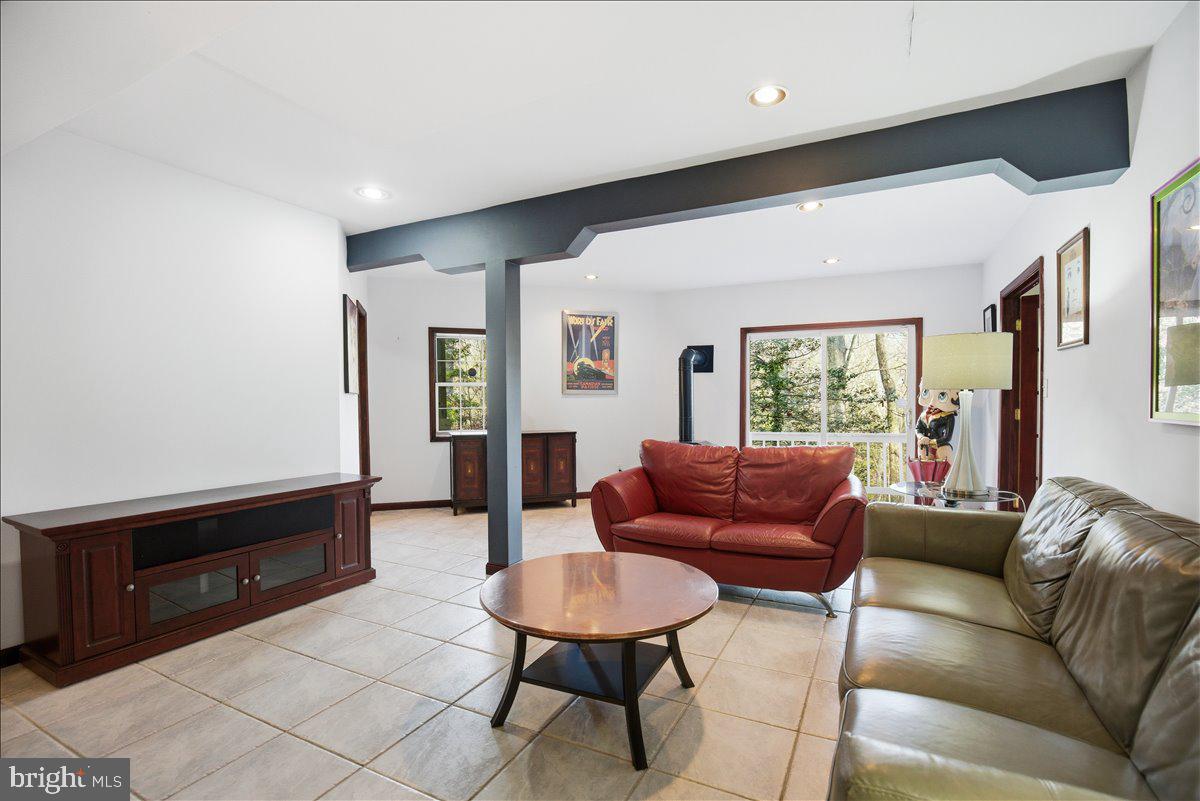 1142 Ranger Ridge Road Lusby, MD 20657 - Photo 30 of 53 a living room with furniture and a window