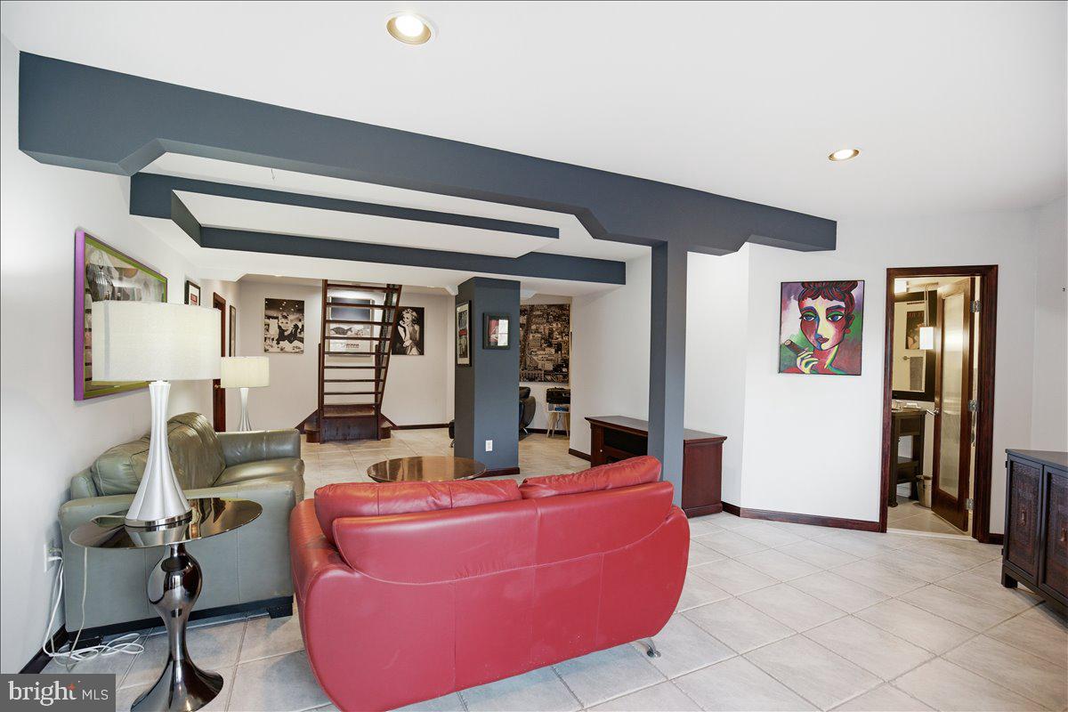1142 Ranger Ridge Road Lusby, MD 20657 - Photo 31 of 53 a living room with furniture and large window