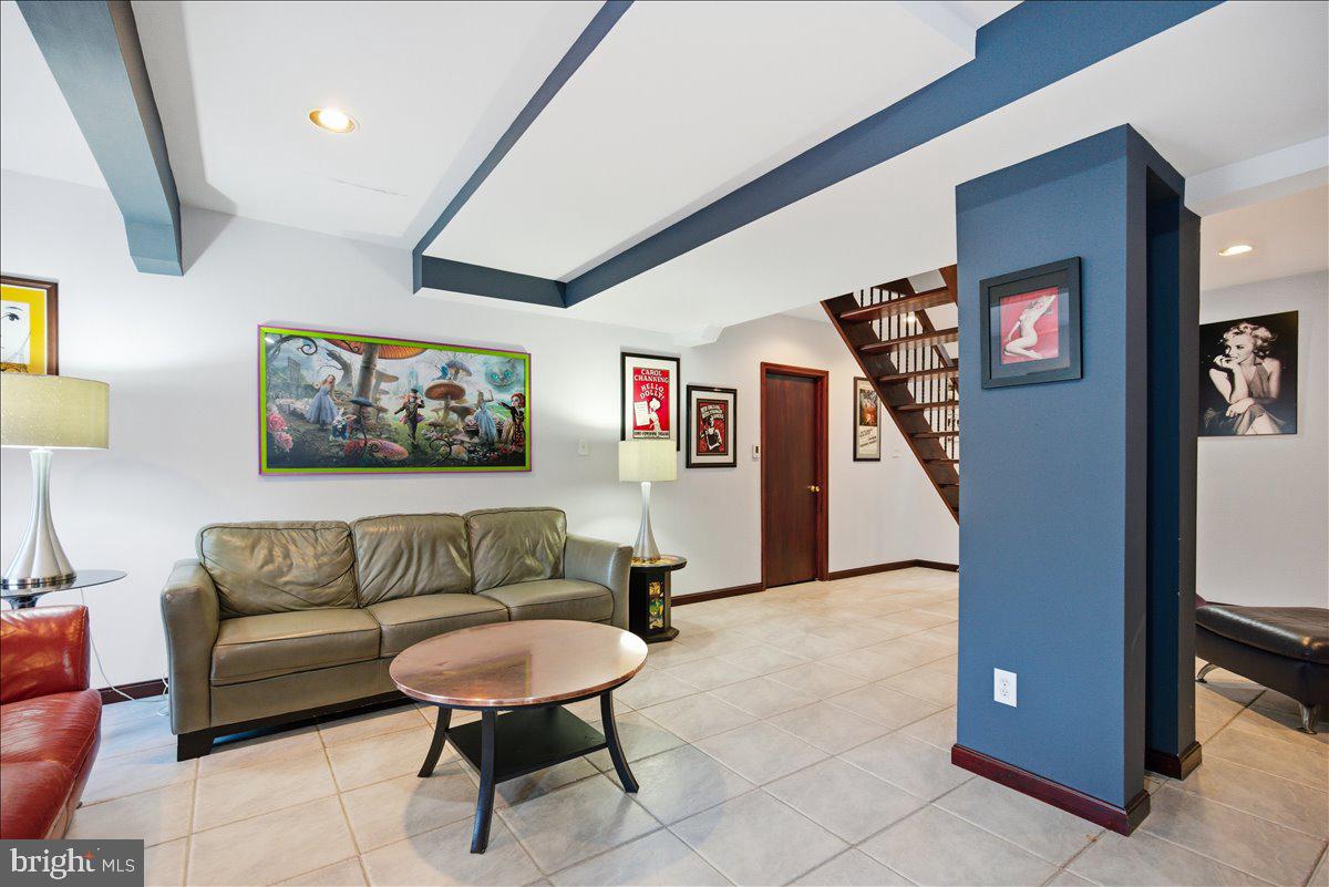 1142 Ranger Ridge Road Lusby, MD 20657 - Photo 32 of 53 a living room with furniture and a flat screen tv