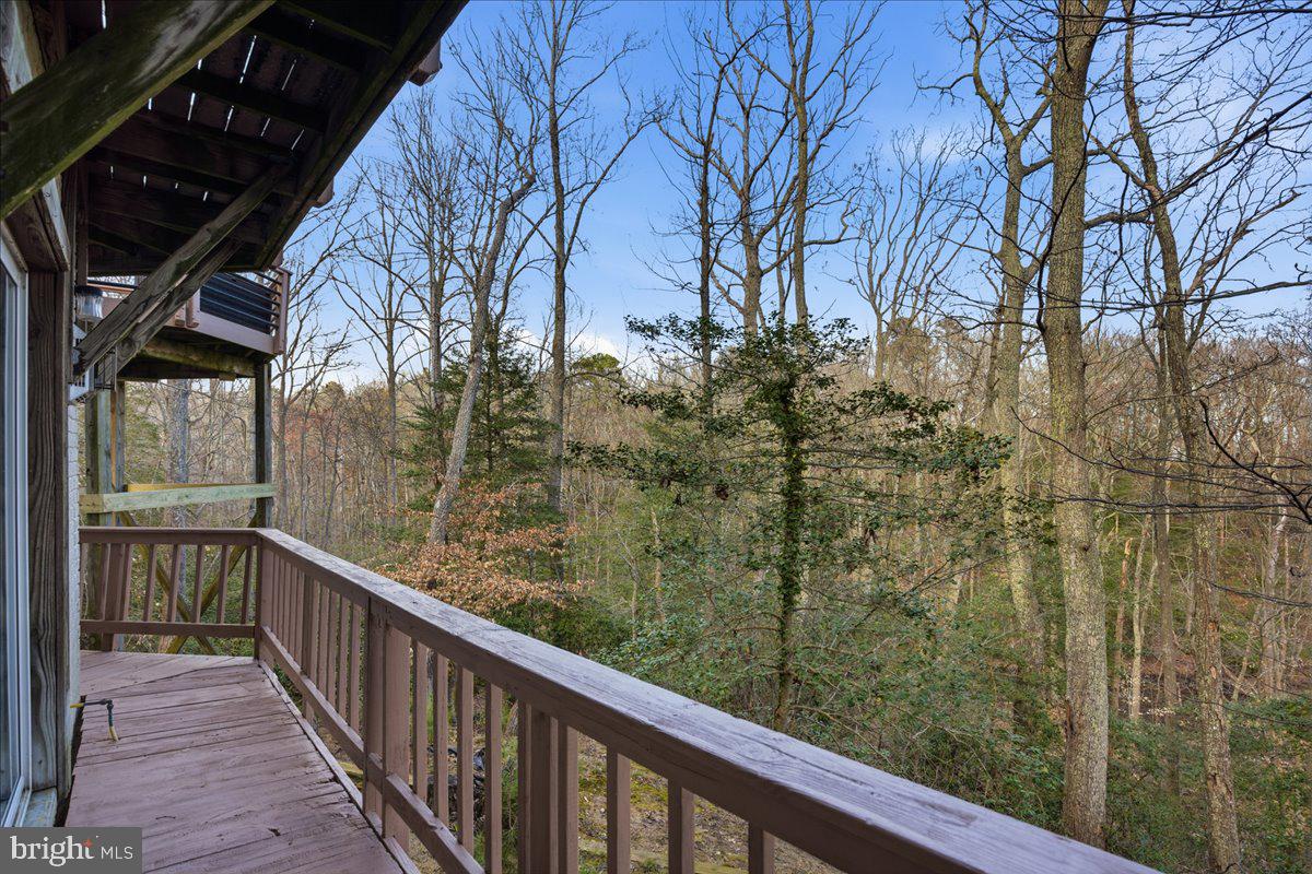 1142 Ranger Ridge Road Lusby, MD 20657 - Photo 36 of 53 a view of a balcony with trees