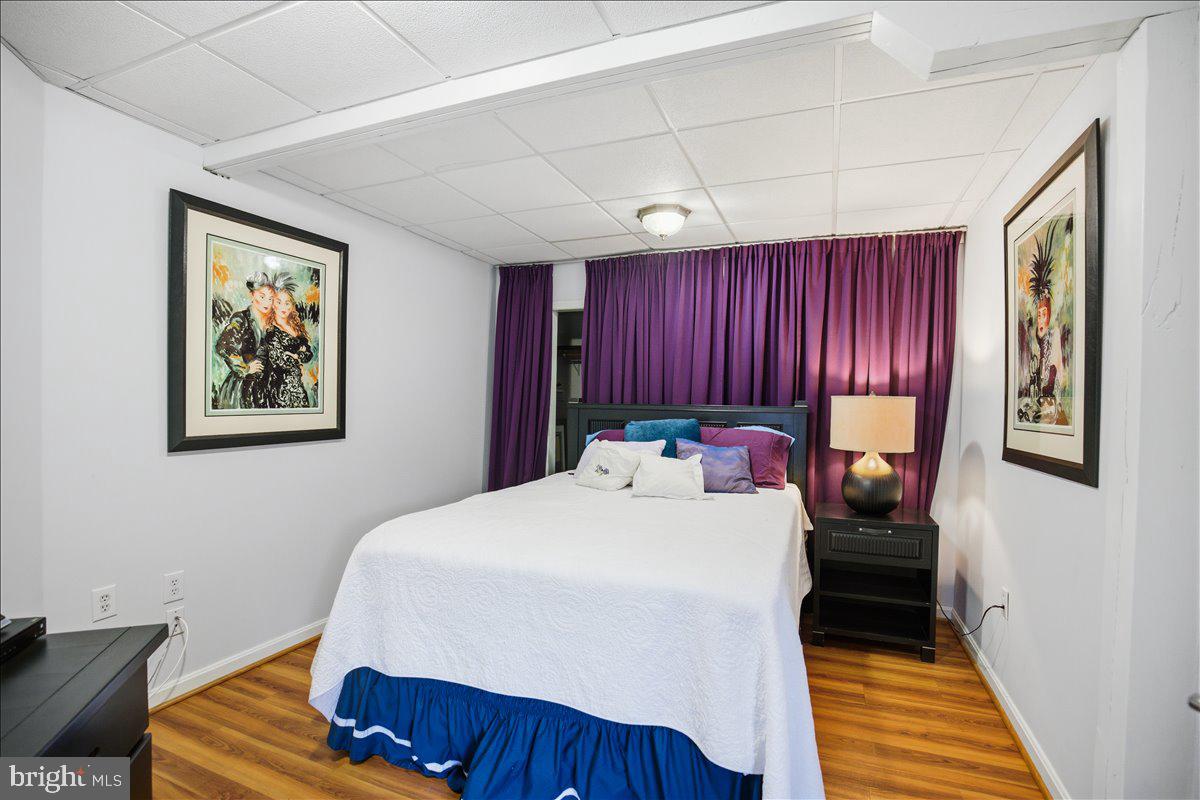 1142 Ranger Ridge Road Lusby, MD 20657 - Photo 38 of 53 a bed room with a bed and a chair