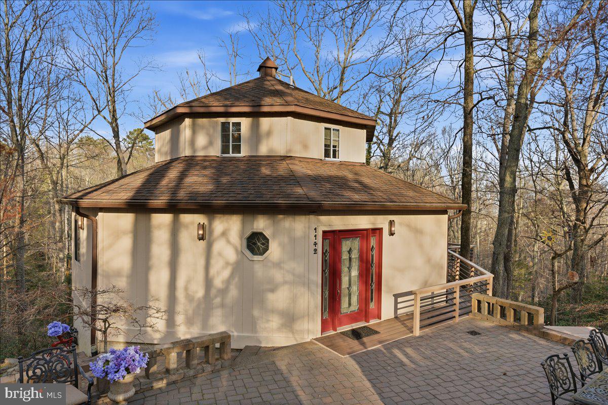 1142 Ranger Ridge Road Lusby, MD 20657 - Photo 42 of 53 a front view of a house with a yard