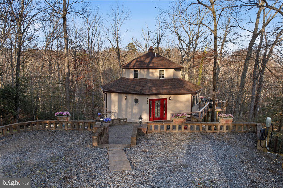1142 Ranger Ridge Road Lusby, MD 20657 - Photo 43 of 53 a view of a chairs and tables in the patio