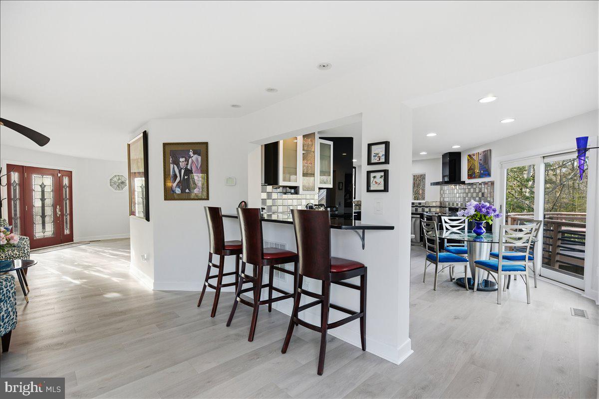 1142 Ranger Ridge Road Lusby, MD 20657 - Photo 10 of 53 a dining room with furniture and wooden floor