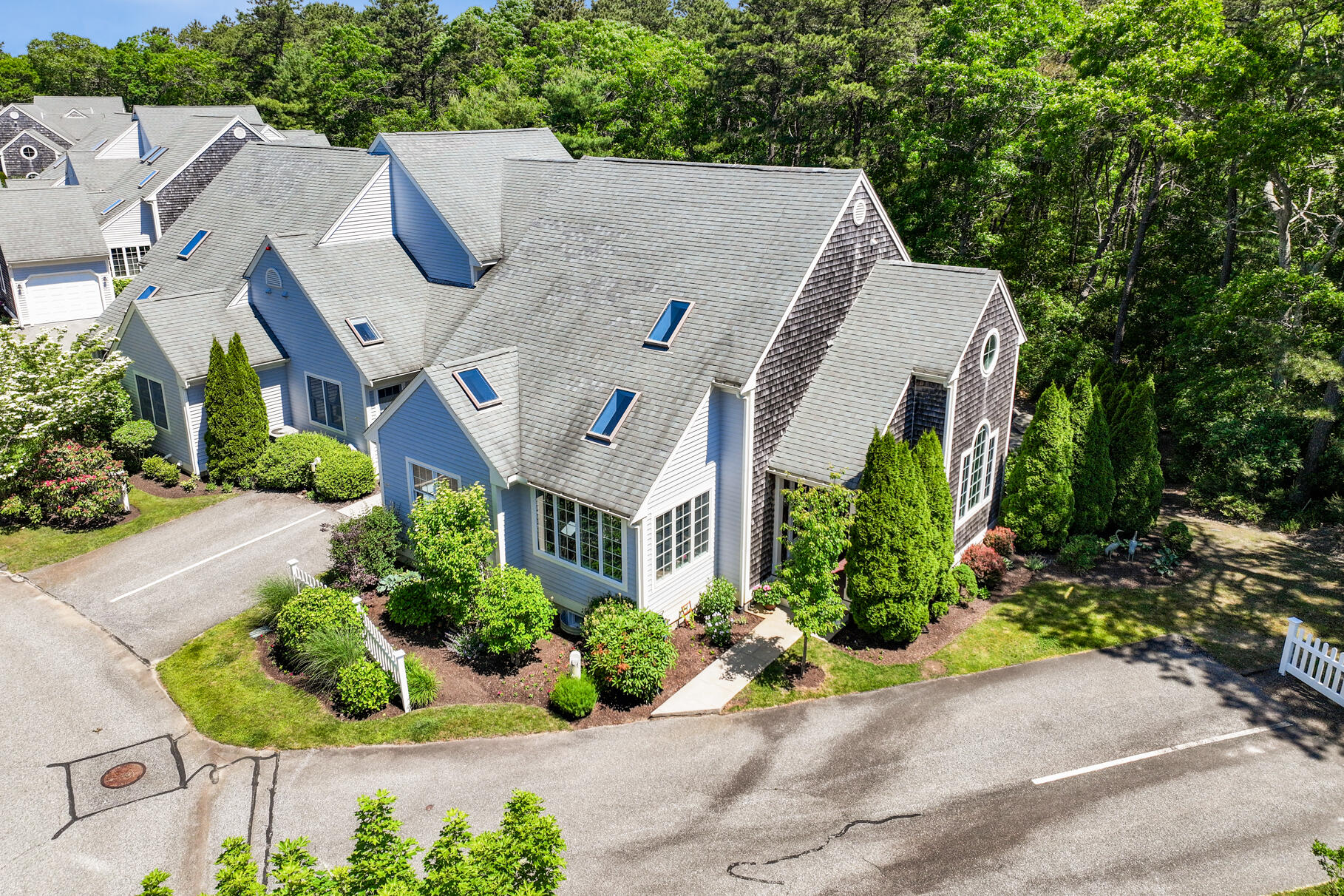 an aerial view of a house with a yard and a garden