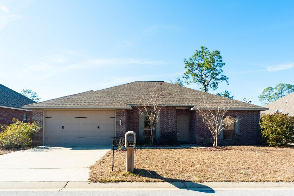 4625 Hermosa Road Crestview, FL 32539 - Photo 1 of 37 a front view of a house with a yard