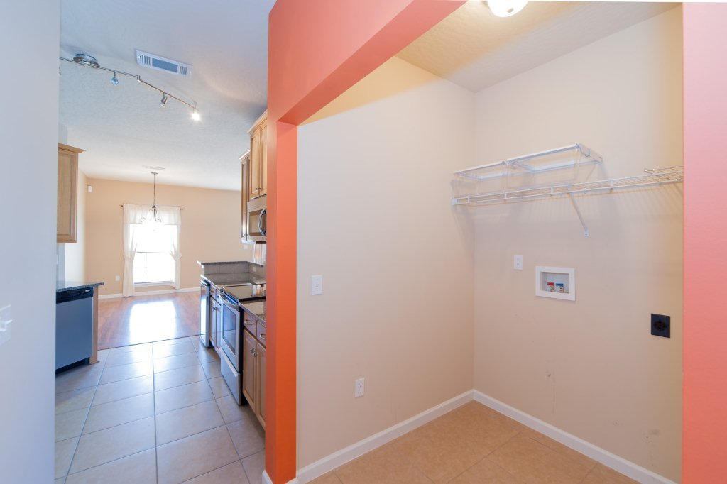 4625 Hermosa Road Crestview, FL 32539 - Photo 15 of 37 a hallway with a view of kitchen and dining room