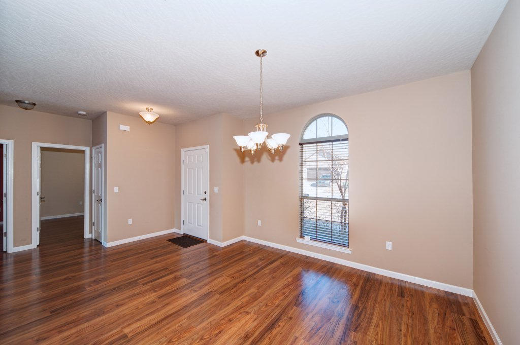 4625 Hermosa Road Crestview, FL 32539 - Photo 17 of 37 a view of a room with wooden floor chandelier and windows