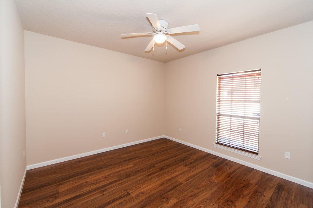 4625 Hermosa Road Crestview, FL 32539 - Photo 23 of 37 wooden floor in an empty room with a window