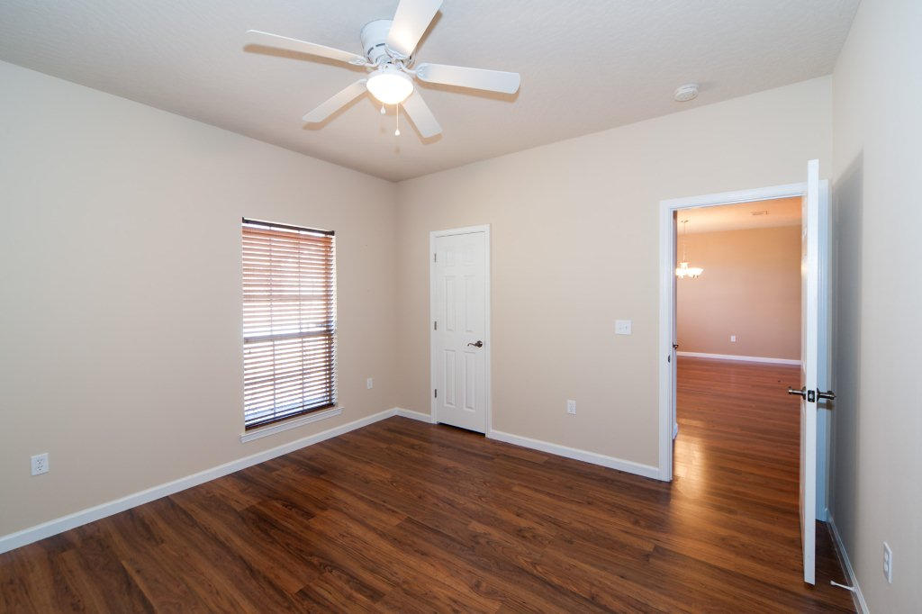 4625 Hermosa Road Crestview, FL 32539 - Photo 24 of 37 wooden floor in an empty room with a window