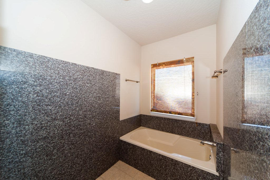 4625 Hermosa Road Crestview, FL 32539 - Photo 25 of 37 a bathroom with a bathtub and shower