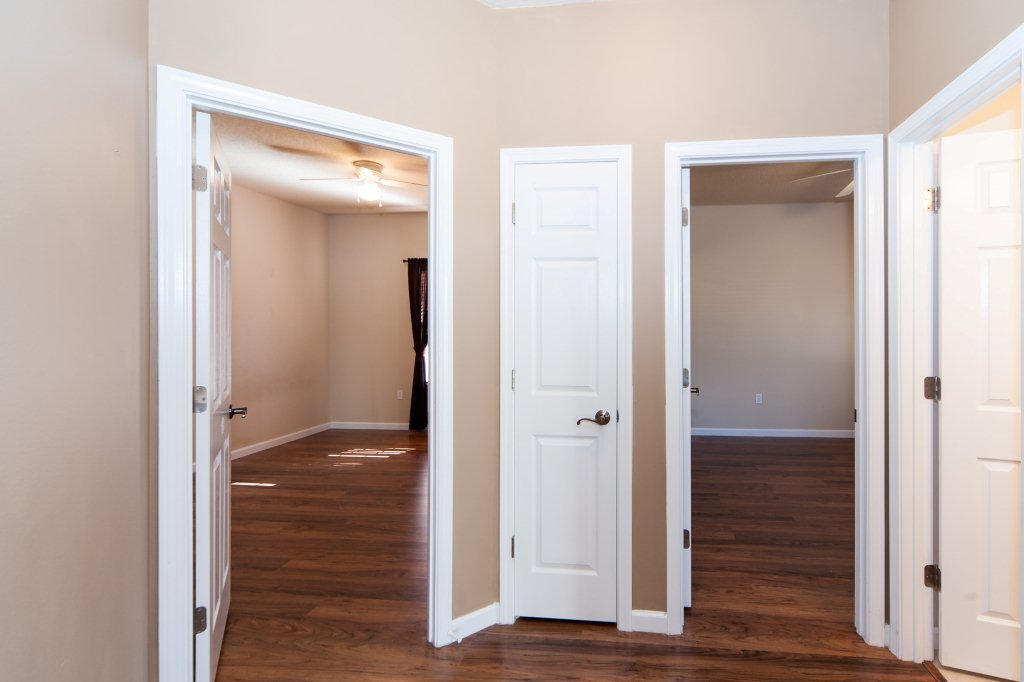 4625 Hermosa Road Crestview, FL 32539 - Photo 28 of 37 a view of a hallway with wooden floor