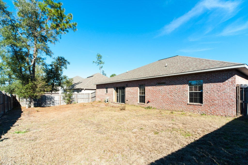 4625 Hermosa Road Crestview, FL 32539 - Photo 34 of 37 a view of a house with a yard
