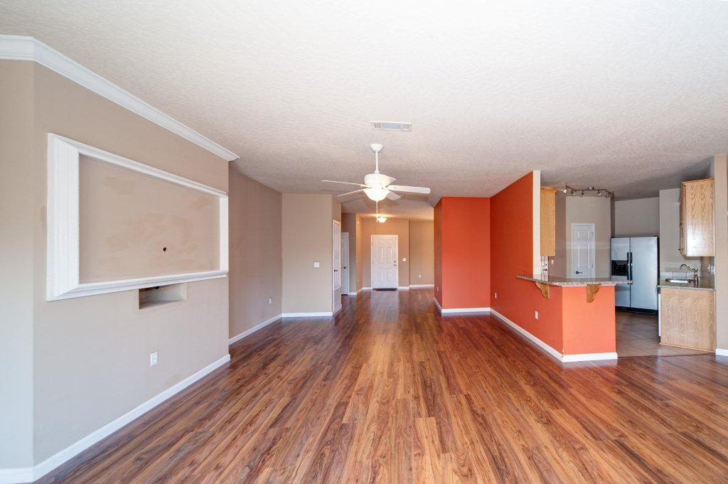 4625 Hermosa Road Crestview, FL 32539 - Photo 7 of 37 wooden floor in an empty room with a window