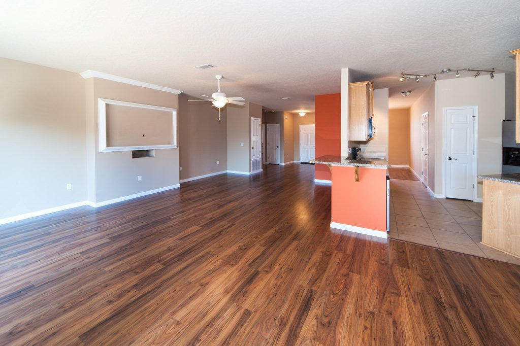 4625 Hermosa Road Crestview, FL 32539 - Photo 9 of 37 a view of a living room hardwood floor and a kitchen
