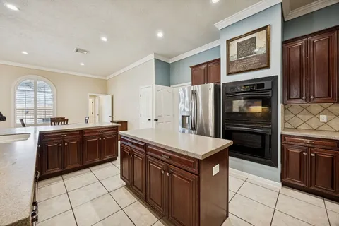 a spacious bedroom with a bed and a fireplace