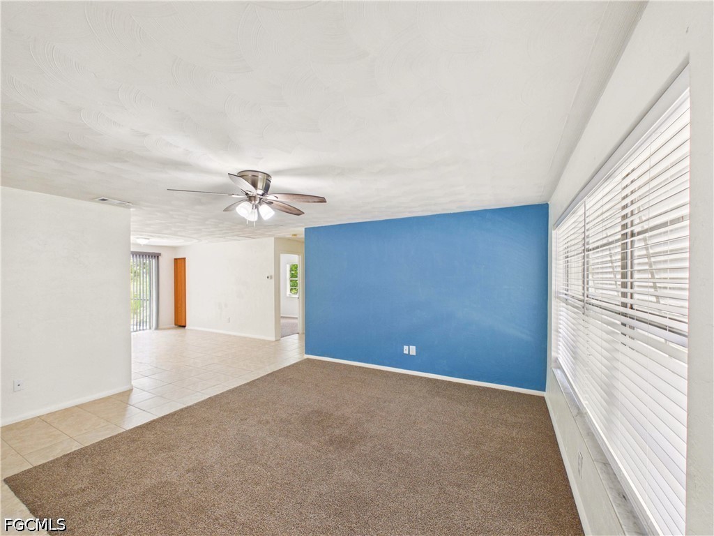 18541 Iris Road Fort Myers, FL 33967 - Photo 3 of 18 a view of an empty room with a window