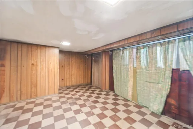 a view of a room with a wooden door