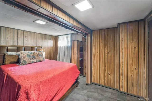 a bedroom with a large bed and a closet