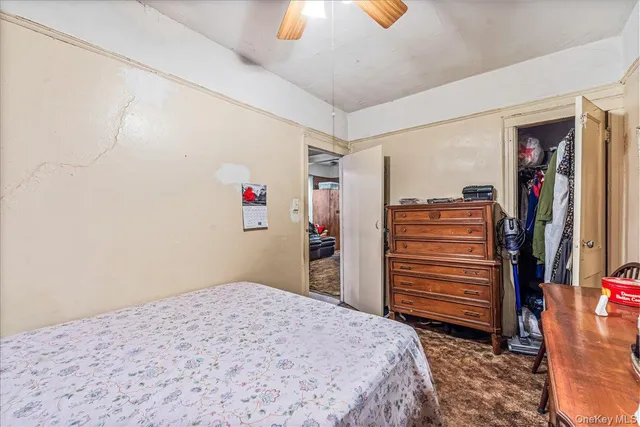 a bedroom with a bed and closet