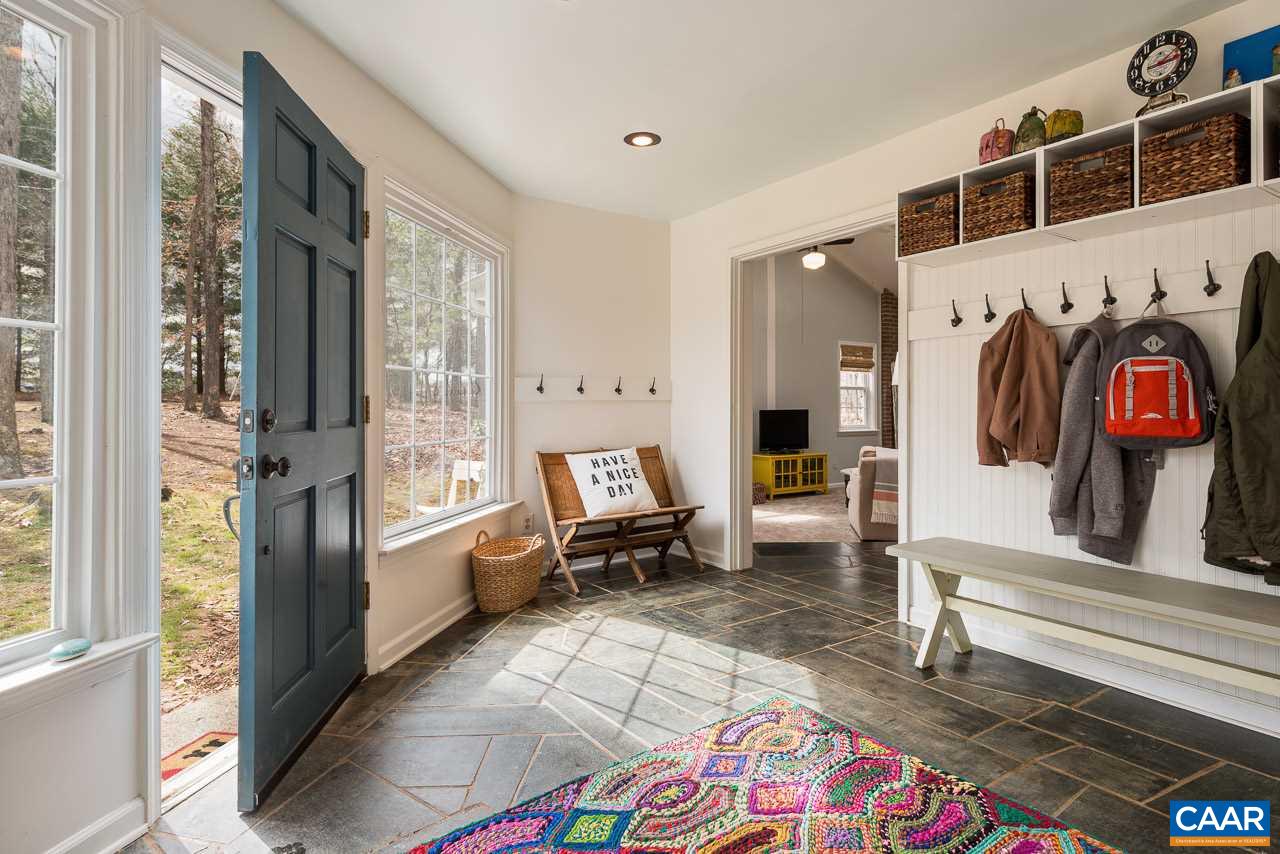 1314 Tilman Road Charlottesville, VA 22901 - Photo 3 of 27 The bright foyer/mudroom entry with soapstone floor, French doors & picture windows is lovely & functional, providing cubbies & hooks.