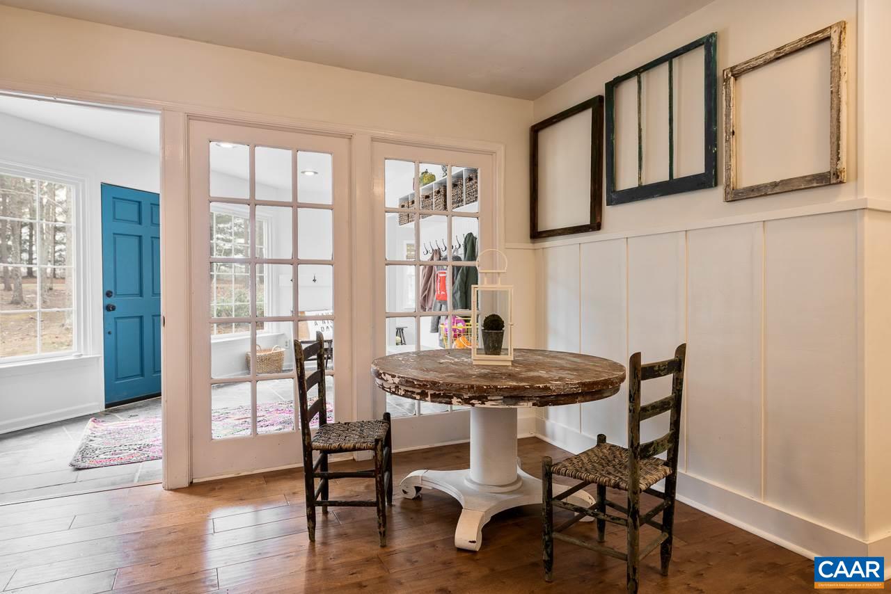 1314 Tilman Road Charlottesville, VA 22901 - Photo 5 of 27 A lovely wall of French doors divides the foyer from the dining room. When closed, it provides additional privacy for the family areas of the home while still allowing light to pass through and maintains a sense of openness and spaciousness.