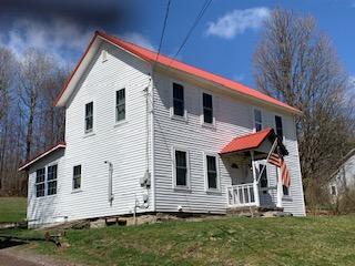 320 Village Road Dallas, PA 18612 - Photo 1 of 29 a front view of a house with a yard