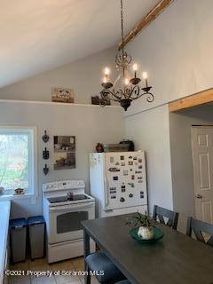 320 Village Road Dallas, PA 18612 - Photo 11 of 29 a kitchen with stainless steel appliances kitchen island granite countertop a stove and a refrigerator