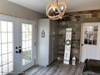 320 Village Road Dallas, PA 18612 - Photo 13 of 29 a room with wooden floor and furniture