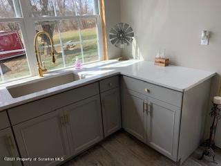 320 Village Road Dallas, PA 18612 - Photo 15 of 29 a sink with a window and mirror