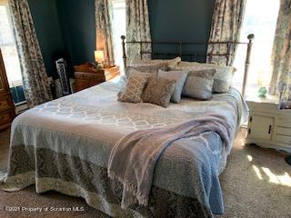 320 Village Road Dallas, PA 18612 - Photo 16 of 29 a bedroom with a bed and a window
