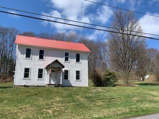 320 Village Road Dallas, PA 18612 - Photo 19 of 29 a view of a house with a yard