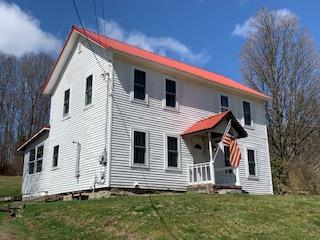 320 Village Road Dallas, PA 18612 - Photo 20 of 29 a front view of a house with a yard