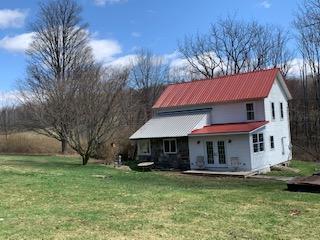 320 Village Road Dallas, PA 18612 - Photo 21 of 29 a view of a house with a yard