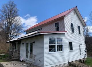 320 Village Road Dallas, PA 18612 - Photo 22 of 29 a front view of a house with yard