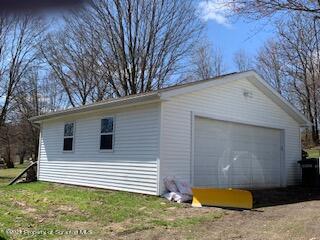 320 Village Road Dallas, PA 18612 - Photo 23 of 29 a view of a house with backyard and trees