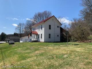 320 Village Road Dallas, PA 18612 - Photo 24 of 29 a view of a house with a yard