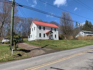 320 Village Road Dallas, PA 18612 - Photo 25 of 29 a view of a house with a yard