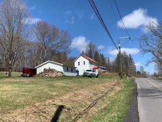 320 Village Road Dallas, PA 18612 - Photo 26 of 29 a view of a house with a yard