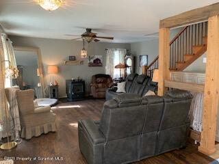 320 Village Road Dallas, PA 18612 - Photo 3 of 29 a living room with furniture a fireplace and a chandelier