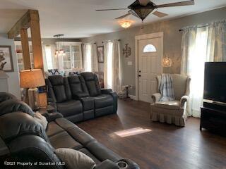 320 Village Road Dallas, PA 18612 - Photo 4 of 29 a living room with furniture and a flat screen tv