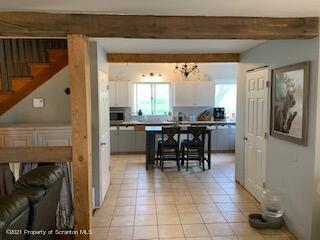 320 Village Road Dallas, PA 18612 - Photo 6 of 29 a view of a kitchen and dining room